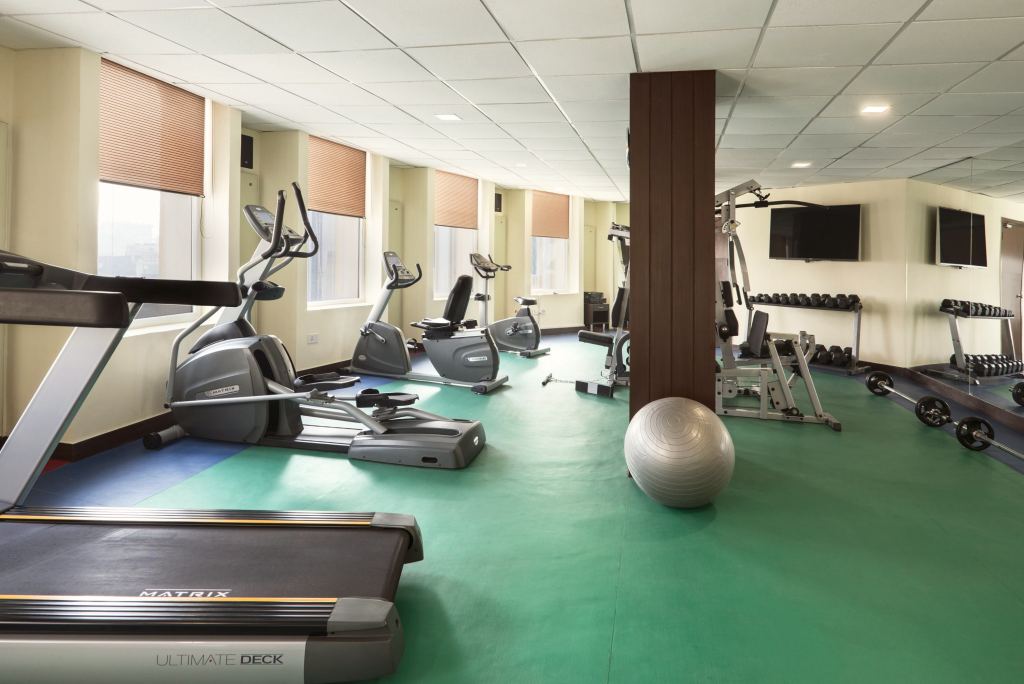 Fitness Center with a treadmill, cross trainer, exercise bikes, a multi-gym and dumbbell racks
